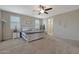 Large main bedroom with carpeted flooring and ceiling fan at 22446 E Russet Rd, Queen Creek, AZ 85142