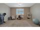 Bright home office features a desk, seating, and large window at 22446 E Russet Rd, Queen Creek, AZ 85142