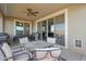 Covered patio with table, chairs, grill, and ceiling fan at 22446 E Russet Rd, Queen Creek, AZ 85142