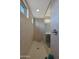 Walk in shower with tiled walls and window at 22446 E Russet Rd, Queen Creek, AZ 85142