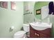 Clean bathroom with a single vanity, toilet, and decorative wall at 4102 S 186Th Ave, Goodyear, AZ 85338