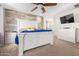 Primary bedroom with large bed, dresser, and a flat screen TV at 4102 S 186Th Ave, Goodyear, AZ 85338