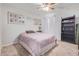 Cozy bedroom with double bed, bookcase, and window at 4102 S 186Th Ave, Goodyear, AZ 85338