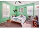 bedroom with green walls, toys, and bookshelves at 4102 S 186Th Ave, Goodyear, AZ 85338