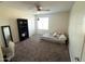 Bright bedroom with carpeted floor, a bookcase, and a bed at 4102 S 186Th Ave, Goodyear, AZ 85338