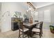 Dining area with a rustic wooden table and chandelier at 4102 S 186Th Ave, Goodyear, AZ 85338
