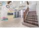 Living room with a staircase and a baby gate at 4102 S 186Th Ave, Goodyear, AZ 85338