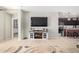 Living room with TV and view into kitchen at 4102 S 186Th Ave, Goodyear, AZ 85338