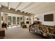 Bright bedroom with fireplace, French doors leading to patio, and sitting area at 6701 N Scottsdale Rd # 20, Scottsdale, AZ 85250