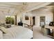 Spacious bedroom with high ceilings, lots of natural light, and access to a private patio at 6701 N Scottsdale Rd # 20, Scottsdale, AZ 85250