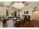 Formal dining room with a glass-top table and hardwood floors at 6701 N Scottsdale Rd # 20, Scottsdale, AZ 85250