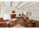 Living room with hardwood floors, exposed beams and built-in cabinetry at 6701 N Scottsdale Rd # 20, Scottsdale, AZ 85250