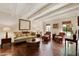 Living room with hardwood floors, exposed beams, and built-in shelving at 6701 N Scottsdale Rd # 20, Scottsdale, AZ 85250