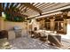 Outdoor patio with pergola, fireplace, and built-in grill at 6701 N Scottsdale Rd # 20, Scottsdale, AZ 85250