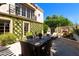 Stone patio with dining table and lush landscaping at 6701 N Scottsdale Rd # 20, Scottsdale, AZ 85250