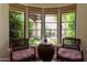 Cozy sitting area with bay windows offering garden views at 6701 N Scottsdale Rd # 20, Scottsdale, AZ 85250