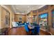 Bright dining area with a live-edge table and blue velvet chairs at 9112 E Sands Dr, Scottsdale, AZ 85255