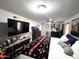 Large main bedroom with a king-size bed and large TV at 9616 W Mountain View Rd # A, Peoria, AZ 85345