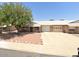 House exterior with driveway and desert landscaping at 9616 W Mountain View Rd # A, Peoria, AZ 85345
