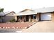 Ranch-style home with a landscaped yard and attached garage at 9616 W Mountain View Rd # A, Peoria, AZ 85345