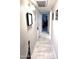 Clean hallway with light gray tiled floors at 9616 W Mountain View Rd # A, Peoria, AZ 85345