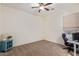 Bedroom with home office setup and window at 12170 S 184Th Ave, Goodyear, AZ 85338