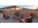 Relaxing fire pit area with comfortable seating for outdoor enjoyment at 12170 S 184Th Ave, Goodyear, AZ 85338