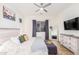 Main bedroom with wood flooring, a ceiling fan, and plenty of natural light at 12170 S 184Th Ave, Goodyear, AZ 85338