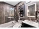 Modern bathroom with a glass-enclosed shower and updated vanity at 12414 N 33Rd St, Phoenix, AZ 85032