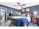 Spacious bedroom with a leather bed frame and ample closet space at 12414 N 33Rd St, Phoenix, AZ 85032