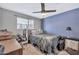 Bedroom with a double bed, home office setup, and window at 12414 N 33Rd St, Phoenix, AZ 85032