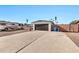 Exterior view of the house and driveway with a large RV parked to the left at 12414 N 33Rd St, Phoenix, AZ 85032