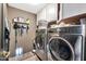 Convenient laundry room with washer, dryer, and pet door at 12414 N 33Rd St, Phoenix, AZ 85032