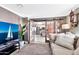 Living room with a comfortable sofa, barn doors, and kitchen view at 12414 N 33Rd St, Phoenix, AZ 85032