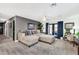 Living room with light beige sectional sofa and access to backyard at 12414 N 33Rd St, Phoenix, AZ 85032