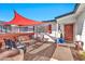 Relaxing patio area with seating and a red shade canopy at 12414 N 33Rd St, Phoenix, AZ 85032
