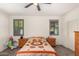 Well-lit bedroom with a queen-size bed and plenty of closet space at 1526 E Saint Catherine Ave, Phoenix, AZ 85042