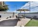 Private backyard with patio furniture and artificial turf at 15547 W Magnolia St, Goodyear, AZ 85338