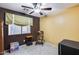 Cozy bedroom featuring a rocking chair and window coverings at 15547 W Magnolia St, Goodyear, AZ 85338