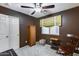 Well-lit bedroom with ceiling fan and double door closet at 15547 W Magnolia St, Goodyear, AZ 85338