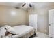 Bedroom with a queen bed and ceiling fan at 15547 W Magnolia St, Goodyear, AZ 85338