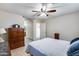 Comfortable bedroom with en-suite bathroom access at 15547 W Magnolia St, Goodyear, AZ 85338