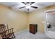 Bedroom with mini-fridge and access to another room at 15547 W Magnolia St, Goodyear, AZ 85338