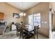 Bright dining area with a table for four and access to the backyard at 15547 W Magnolia St, Goodyear, AZ 85338