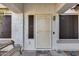 Front entrance with decorative door and welcome mat at 15547 W Magnolia St, Goodyear, AZ 85338