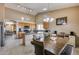 Kitchen with granite countertops, stainless steel appliances, and breakfast bar at 15547 W Magnolia St, Goodyear, AZ 85338