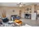 Living room with comfortable seating and built-in shelving at 15547 W Magnolia St, Goodyear, AZ 85338