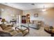 Spacious living room featuring a vaulted ceiling and ample natural light at 15547 W Magnolia St, Goodyear, AZ 85338