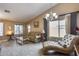 Living room with a chaise lounge, offering a relaxing and elegant atmosphere at 15547 W Magnolia St, Goodyear, AZ 85338