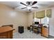 Home office with a desk, chair, and printer at 15547 W Magnolia St, Goodyear, AZ 85338